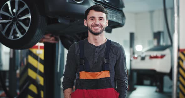 Happy Mechanic Worker From a Auto Service Center