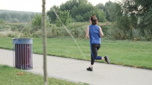 Running and jogging in morning city park