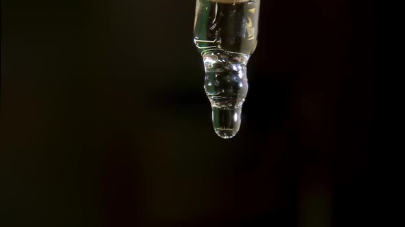 Styling Liquid Drop Drips From Transparent Glass Pipette