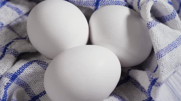 Eggs at the Table Rotation White and Fresh Chicken Eggs