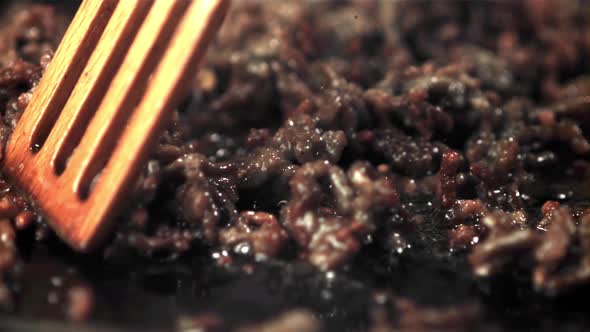 Super Slow Motion Minced Meat Stirred in a Pan with a Spatula