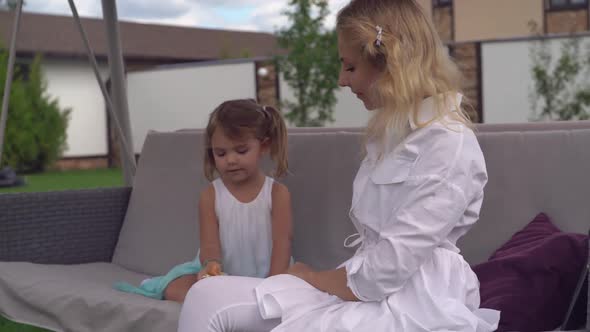 Mom and Kid Playing Outdoors