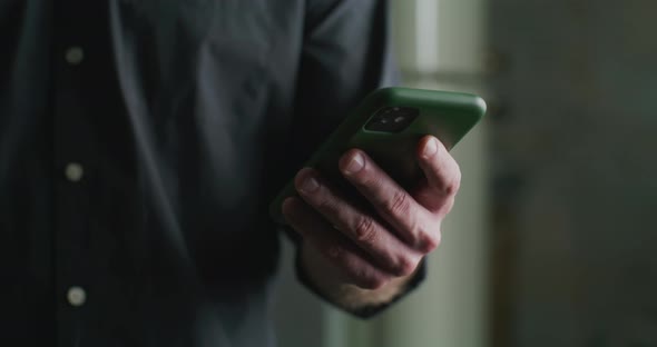 Male Hand Typing a Message on the Phone