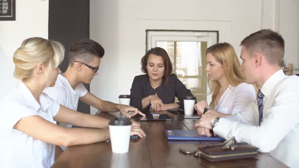 Creative Young Team Together Drinking Coffee Holding A Tablet Discussing A Project Teamwork Coffee