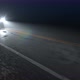 Car Drives Along Country Night Wet Road with Headlights Turned On - VideoHive Item for Sale