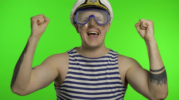 Emotional Man Tourist in Underwater Mask, Striped Sailor Shirt Dances Celebrates