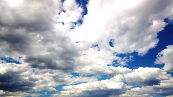 Incredibly thick cloud timelapse with blue sky in the background with highlight