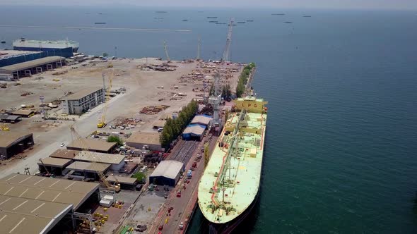 Aerial view Logistics Concept a Cargo Ship Being Retrofit