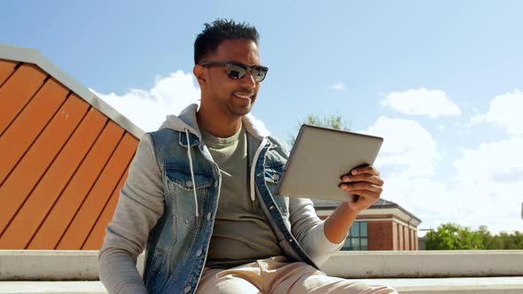 Man with Tablet Pc Drinking Coffee on Roof Top