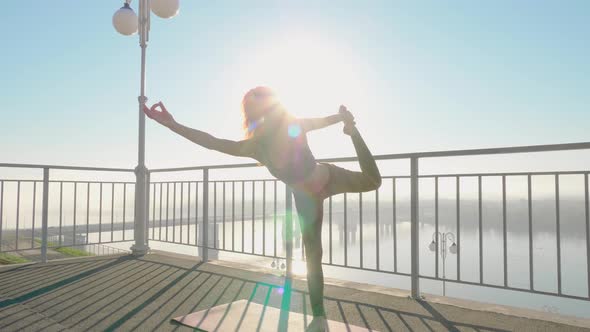 Yoga and Pilates Exercises on the Roof