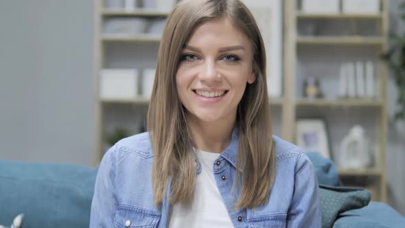 Portrait of Smiling Young Girl Looking at Camera