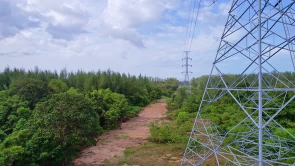 Aerial view high voltage steel power pylons Transmission tower supporting high voltage power line