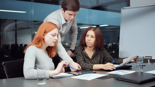 Startup Team Discussing Company Progress During Business Meeting