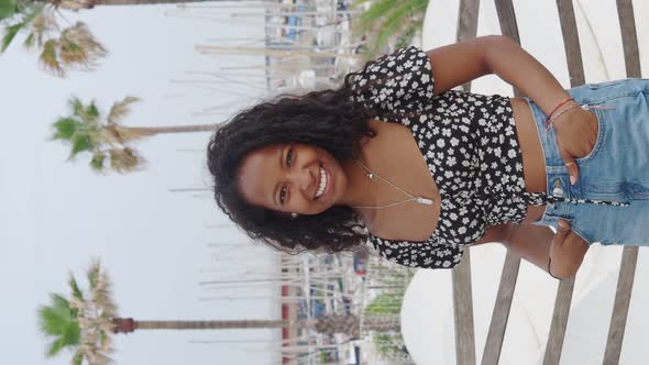 Young Smiling African American Tourist Woman in Paradise Place