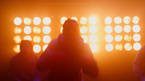 Jumping Dancers Performing Hiphop on Spotlight Close Up