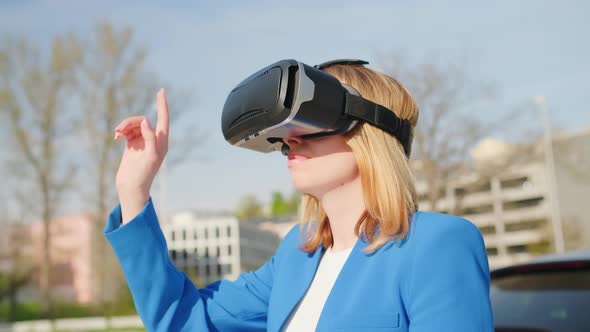 Woman Touching the Air and Open the Windows with Her Finger in Virtual Reality Glasses