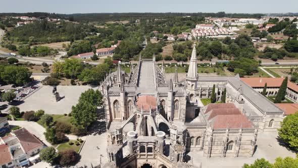 Flamboyant Gothic architecture of Batalha Monastery, Leiria, Portugal. Aerial dolly out