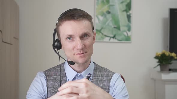 Young Businessman Communicates By Video Link