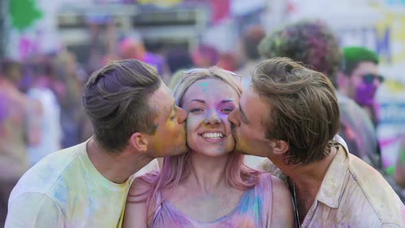 Two Male Friends Kissing Beautiful Girl on Cheeks by Surprise, Happy People