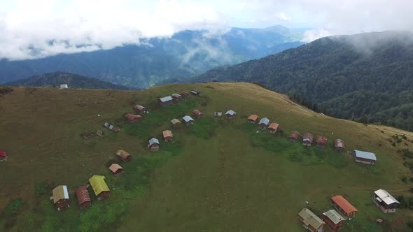 Little Plateau Houses In The Meadow Above Top Of The Hill