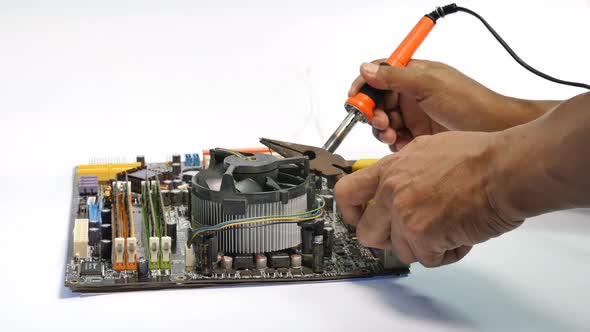 Repair  Mainboard By Using A Hand Tool Used In Soldering