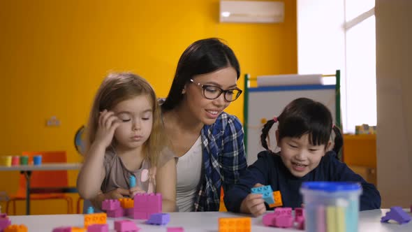 Lovely Diverse Girls Enjoying Playtime in Classroom