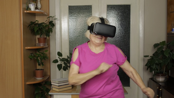 Woman in VR Goggles Dancing, Having Fun. Grandmother in Virtual Headset Watching Amazing 3D Video