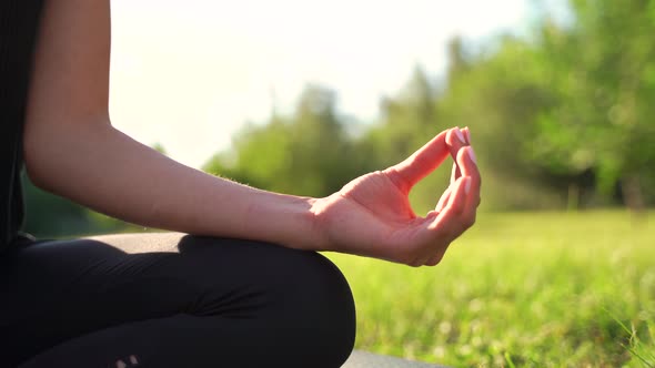 Close Up Pf a Woman Hands Doing Yoga in the Park