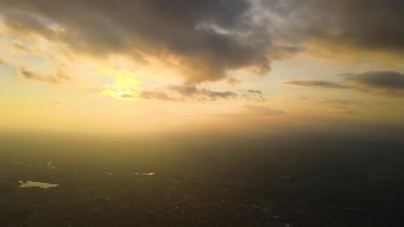 Aerial View From Above at High Altitude of Dense Puffy Cumulus Clouds Flying in Evening