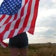 Happy Patriotic Young Woman Holds the US Flag and Runs Across the Field - VideoHive Item for Sale