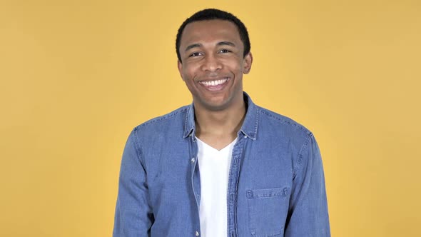 Yes Young African Man Shaking Head to Accept Yellow Background