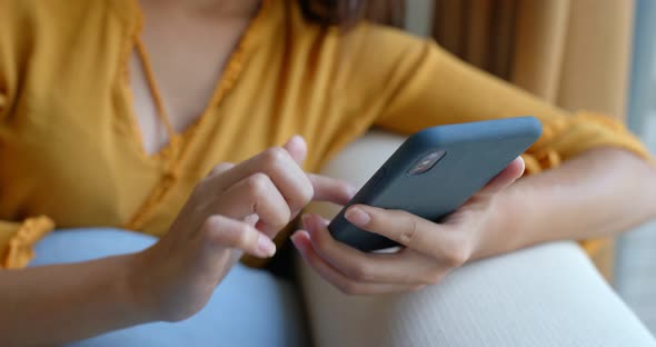 Woman use of smart phone at home