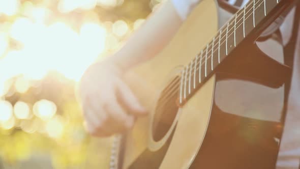 Teen Girl Playing Acoustic Guitar Close Up