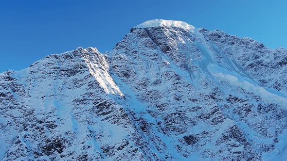 Picturesque Mountain Snowcapped Peak Under Clear Blue Sky