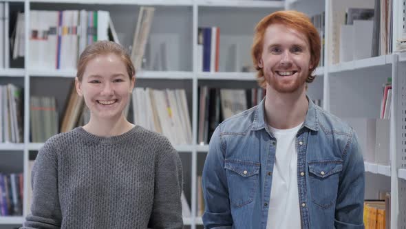 Portrait of Smiling Man and Woman Looking in Camera Team