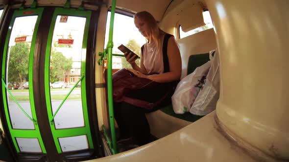 Timelapse of woman with mobile in the bus