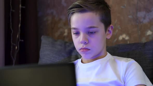 Young Boy at Home with Laptop