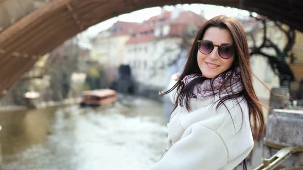 Attractive Smiling Female Tourist Admiring Amazing River View From City Embankment