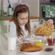 Girl Pouring Cereals Into Bowl During Breakfast - VideoHive Item for Sale