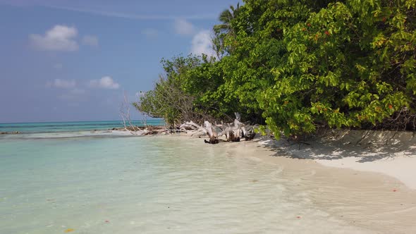 Wide aerial island view of a summer white paradise sand beach and aqua turquoise water background in