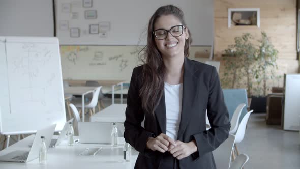 Content Young Businesswoman Smiling at Camera