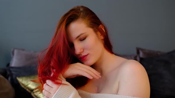 Serene Attractive Young Woman Resting on Couch in Her Room