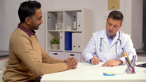 Male Doctor Giving Prescription To Patient 12