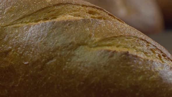 Camera is Zoom Through Sliced and Whole Wheat Bread and Wheat Ears to the Clay Pots