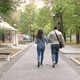 Autumn Cloudy Day City Park Man Woman Holding Hands Go Along Path View From Back - VideoHive Item for Sale