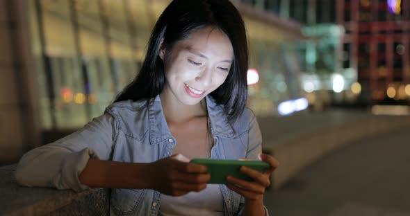 Woman use of cellphone at street