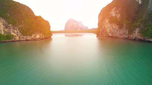 Aerial view over the coast, mountains and beaches during beautiful sunsets