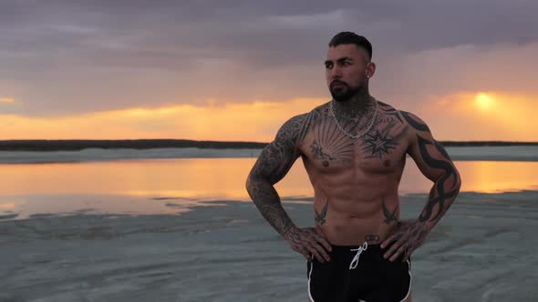 Masculine Man on Shore at Sunset