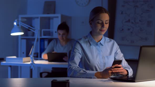 Businesswoman with Smartphone at Dark Night Office 91