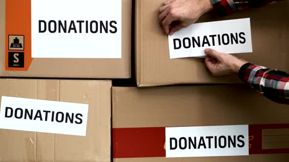 Volunteer sticks Donations  sticker on a Donation cardboard Box
